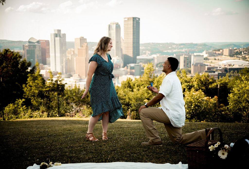 Man Proposing to woman at Emerald Park in Pittsburgh