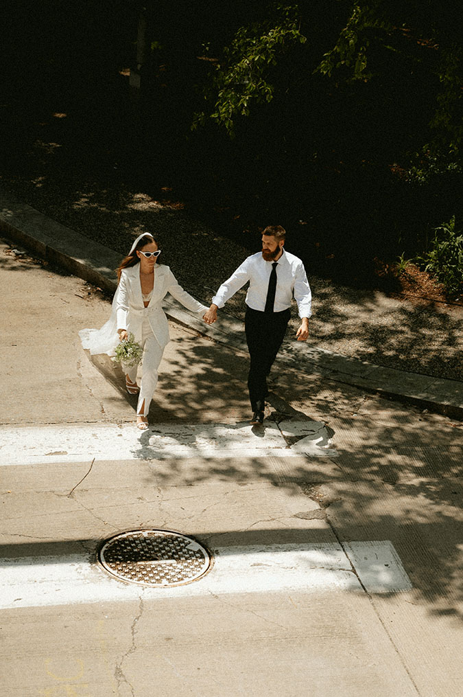 Pittsburgh allegheny courthouse Wedding Elopement Couple walking down the street in Downtwon