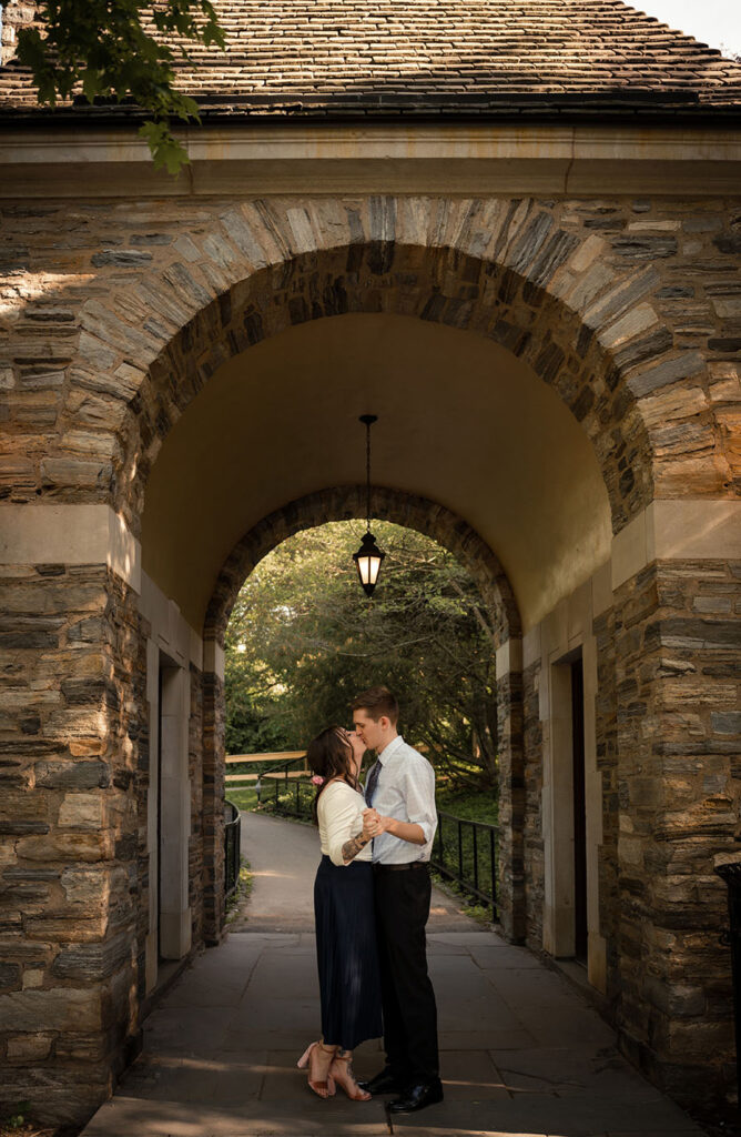 Couple Kiss at Frick Park arc celebrating Engagement