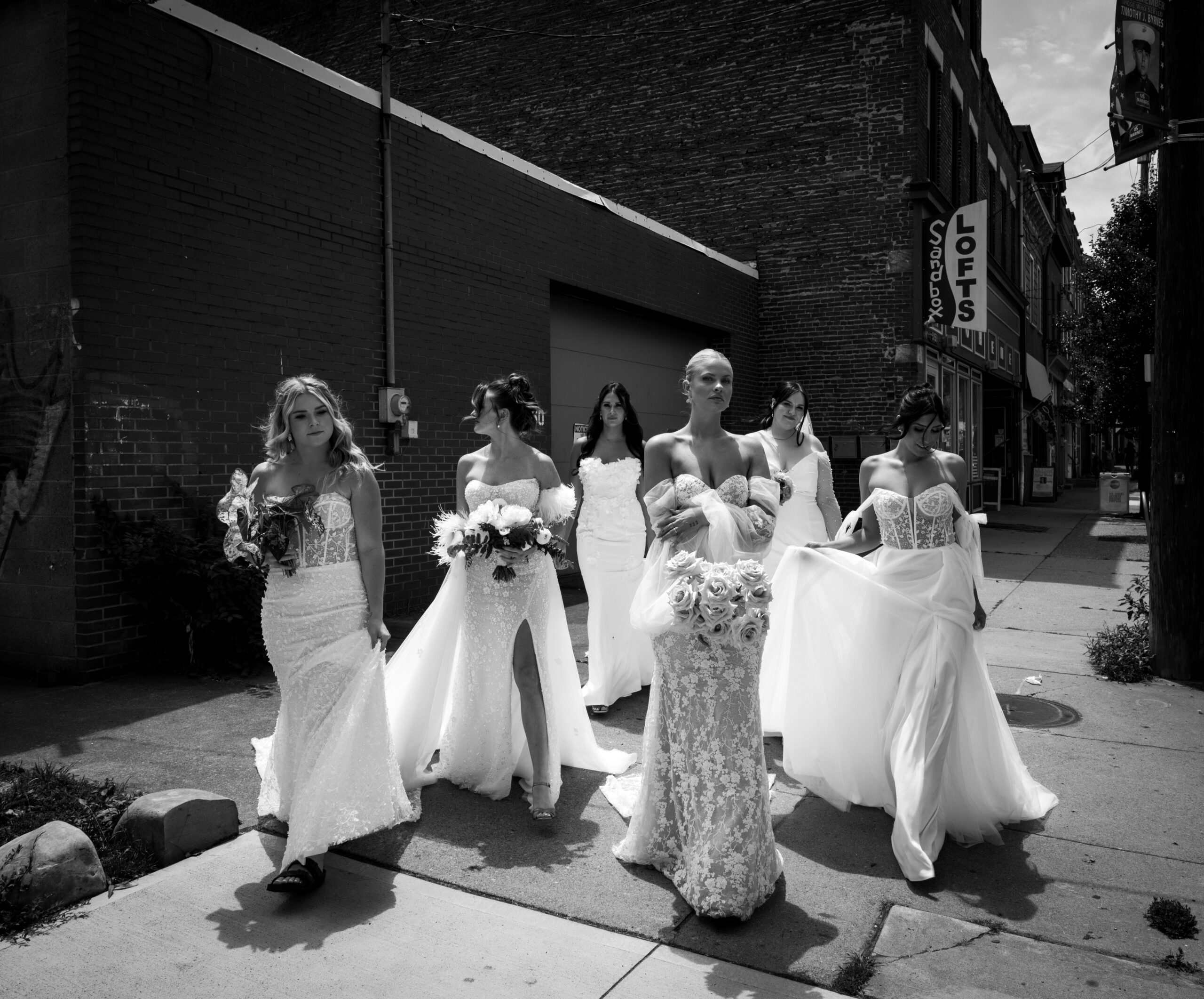 Pittsburgh Wedding Brides standing in Lawrenceville in their wedding Gowns