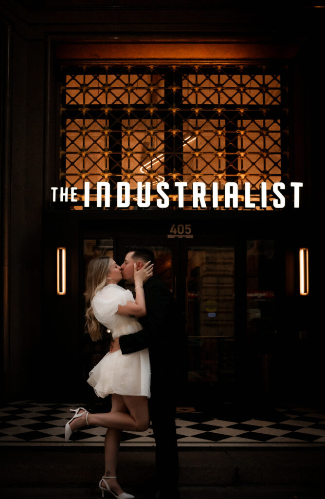 Engaged Couple Kissing in front of the Industrialist Hotel in Pittsburgh