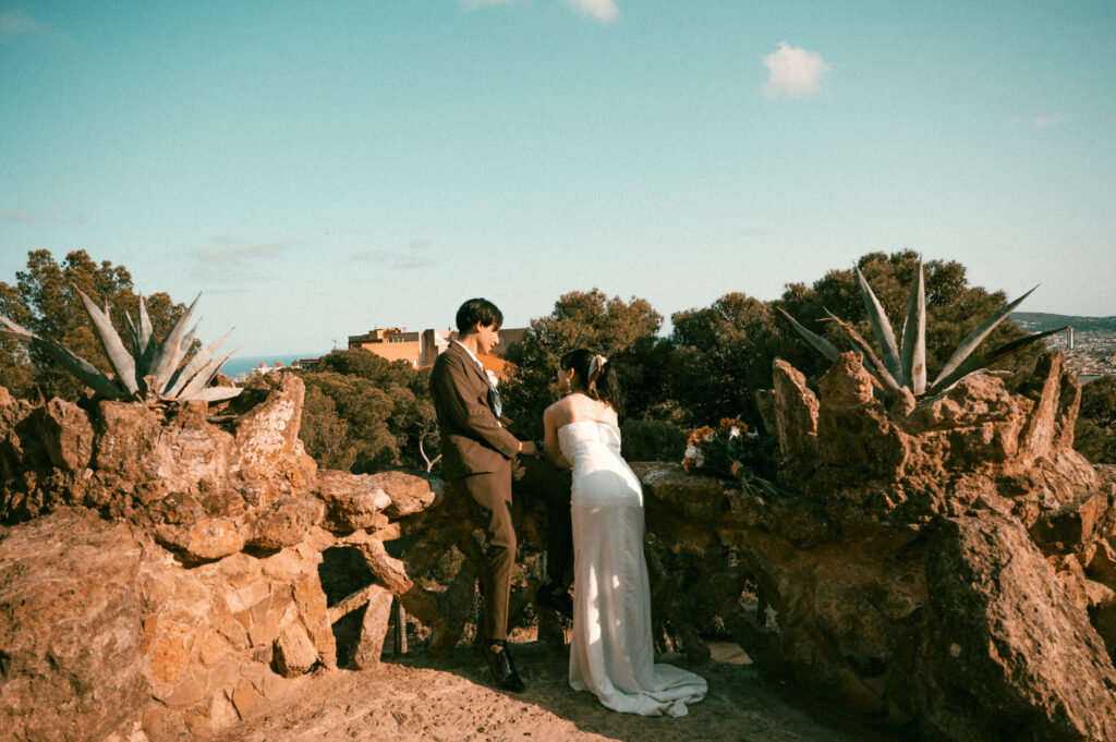 Bride and Groom overlooking Barcelona from Park Guell after wedding ceremony