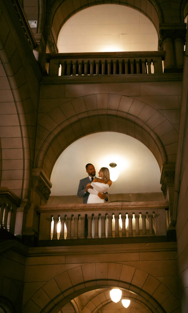 Bride and Groom looking at each other in the Allegheny Courthouse after their Elopement in Downtown Pittsburgh