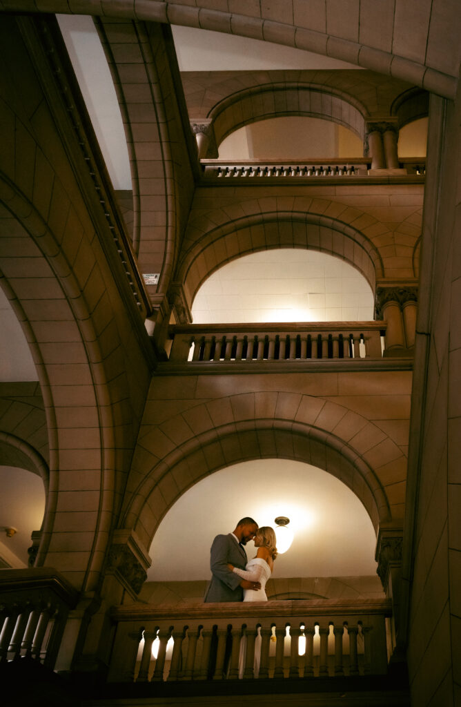 Bride and Groom facing each other in the Allegheny Courthouse after their Elopement in Downtown Pittsburgh