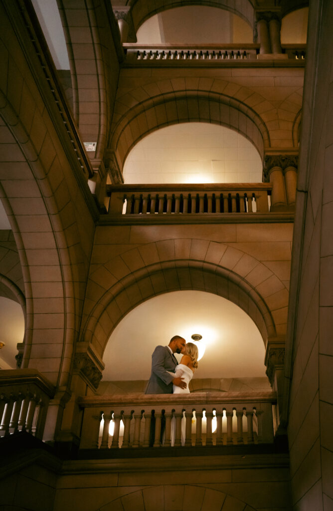 Bride and Groom kissing up in the Allegheny Courthouse after their Elopement in Downtown Pittsburgh