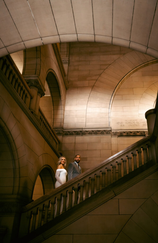 Bride and Groom walking up the Allegheny Courthouse after their Elopement in Downtown Pittsburgh