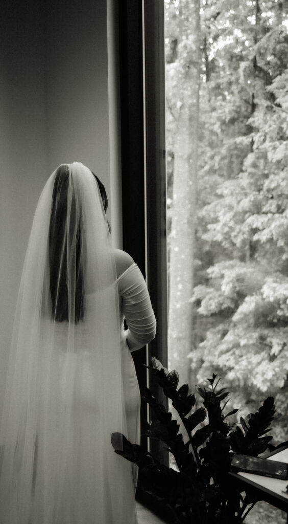 Bride looking away with a vail in black and white at Pittsburgh Botanic Garden
