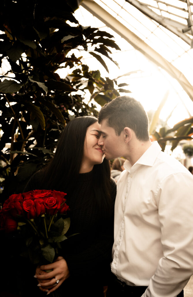 Couple kiss in Phipps Conservatory and Botanical Gardens