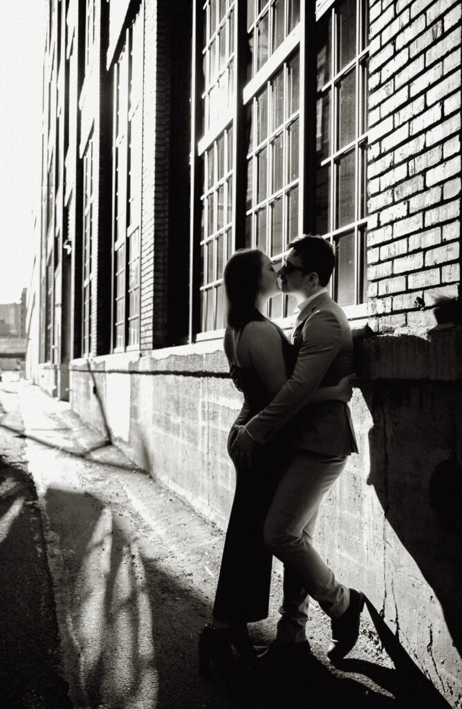couple about to kiss in an alley in the strip district