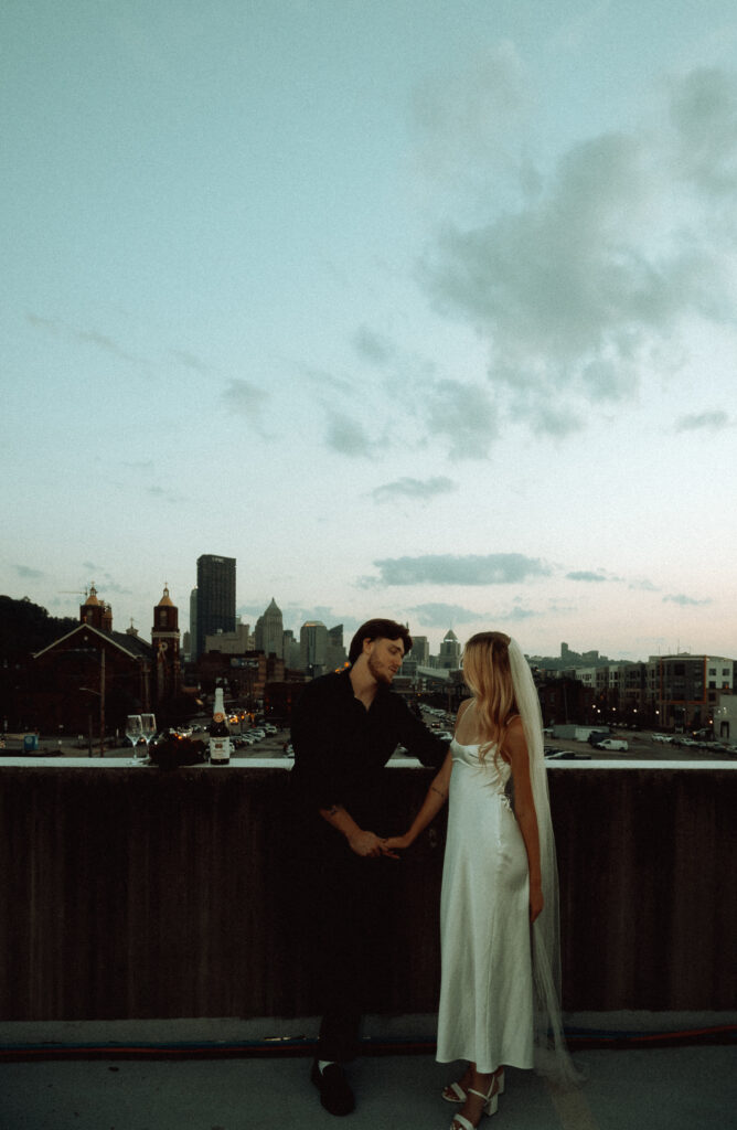 Bride and Groom looking at each other in Pittsburgh rooftop