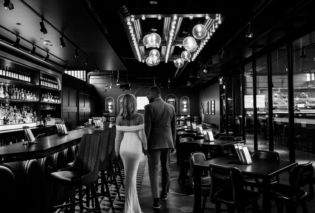 Bride and Groom walking out of a bar in Pittsburgh