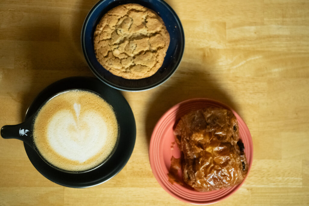 Lavender oat milk latte with chocolate chip cookie and chocolate croissant. 