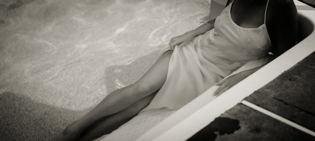 Boudoir photo of Bride laying down in a pool