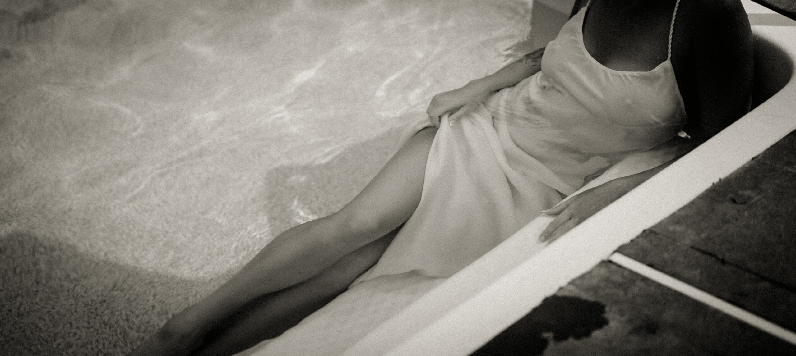 Sexy photo ofBride laying down in a pool