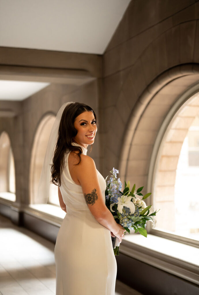 Bride smiling before her elopement at the Allegheny Courthouse before her wedding