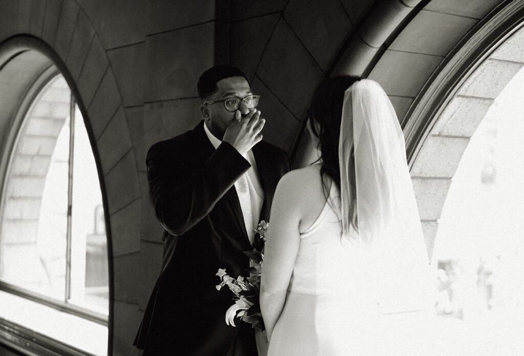 Groom cries before bride after their first look at the Allegheny Courthouse in Downtown Pittsburgh