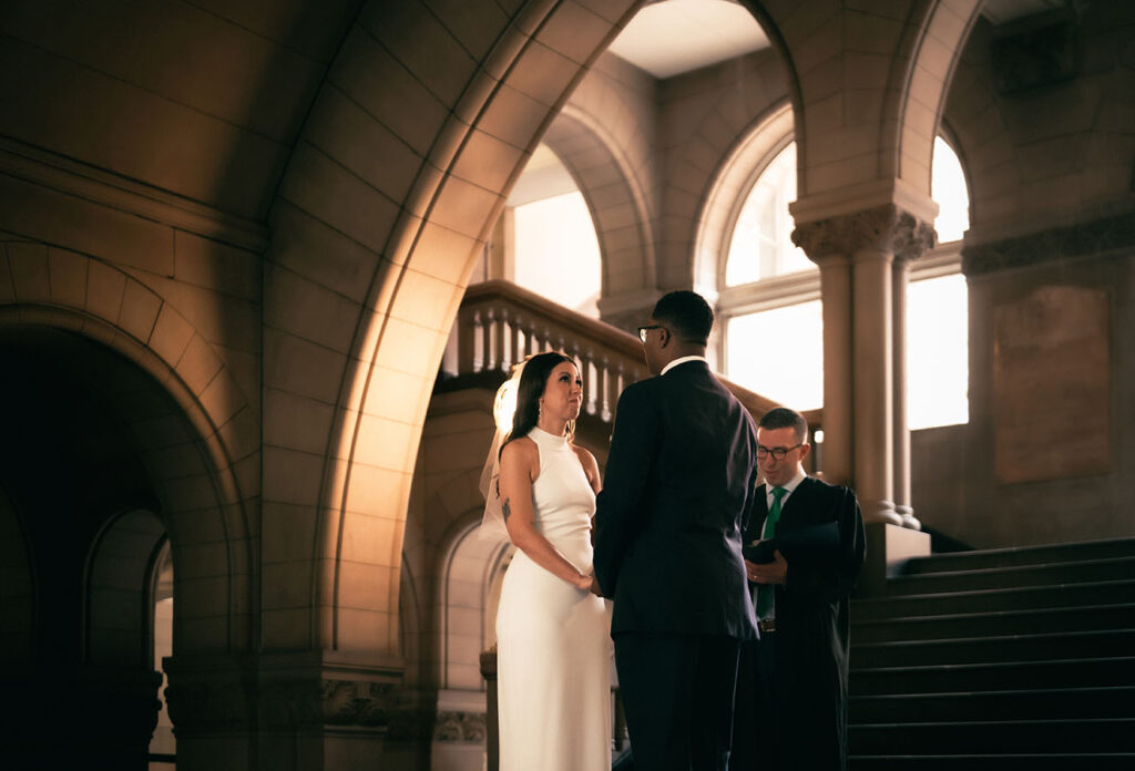 Couple in front of the Allegheny Courthouse during their civil wedding in Pittsburgh PA