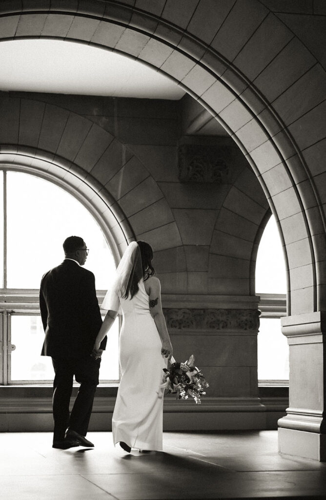 Romantic Black and White Bride and Groom walking away from their wedding ceremony at the Allegheny Courthouse
