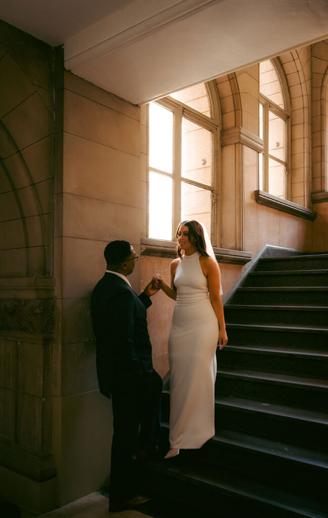 Bride and Groom walking up the Allegheny Courthouse after their Elopement in Downtown Pittsburgh