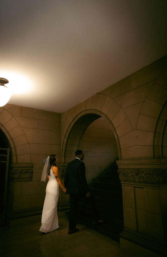 Bride and Groom walking away at the Allegheny Courthouse after their Elopement in Downtown Pittsburgh