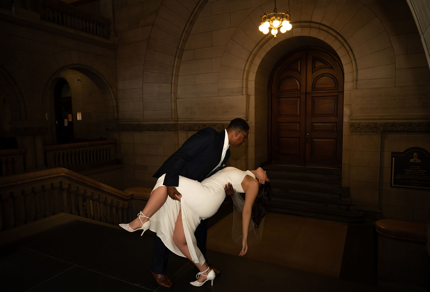 Groom dips bride at the Allegheny Courthouse after their Elopement in Downtown Pittsburgh