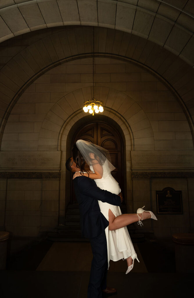 Bride and Groom kiss passionately after their elopement at the Allegheny Courthouse in Pittsburgh PA