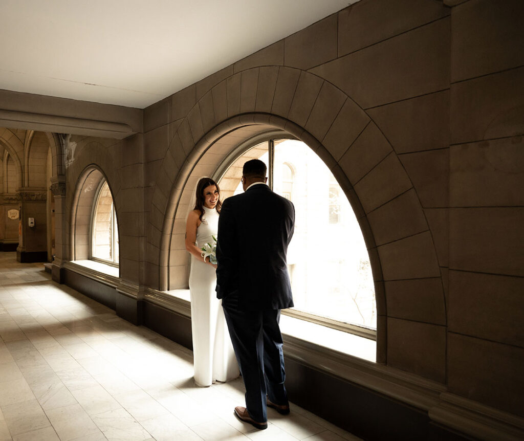 Bride and Groom looking at each other after their first look at the Allegheny Courthouse after their Elopement in Downtown Pittsburgh