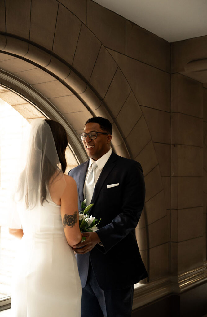 Bride and groom see each other at the Allegheny Courthouse before wedding