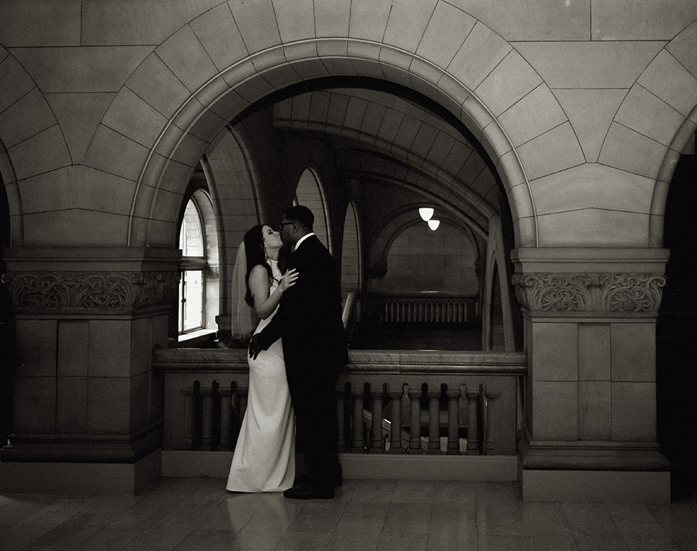 Romantic Black and white Bride and Groom Embrace each other at the Allegheny Courthouse. 