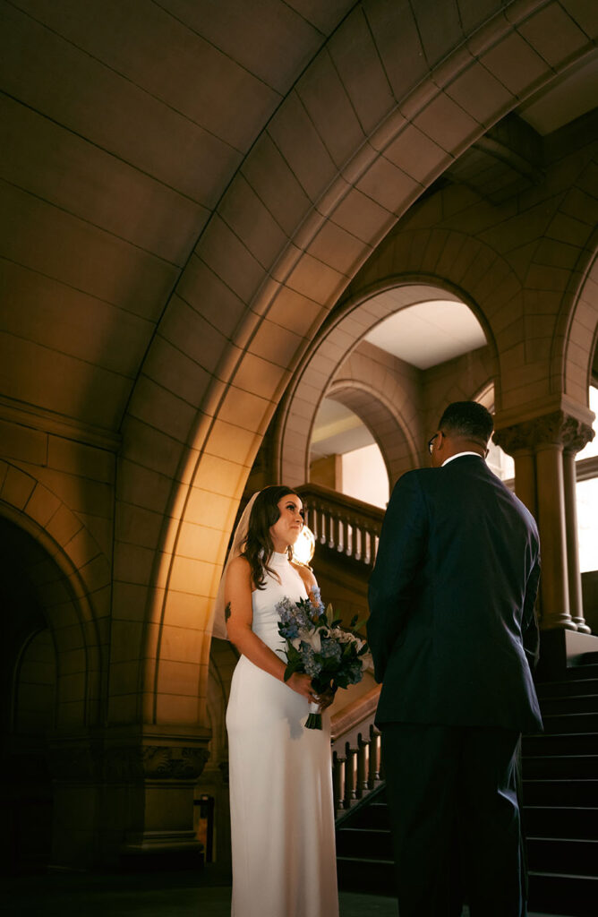 Couple facing the judge at the Allegheny Courthouse during their civil wedding in Downtown Pittsburgh