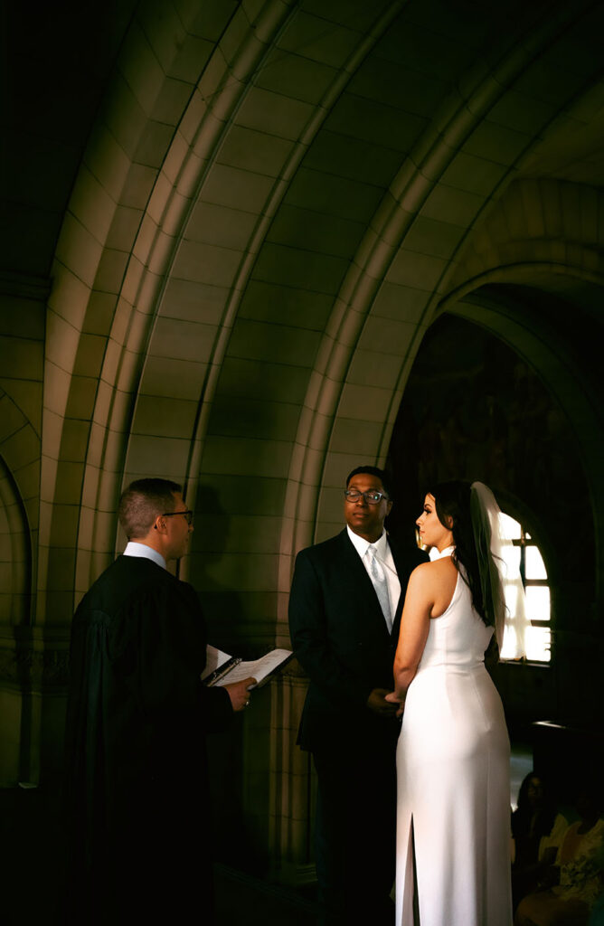 Couple facing the judge at the Allegheny Courthouse during their civil wedding in Pittsburgh PA