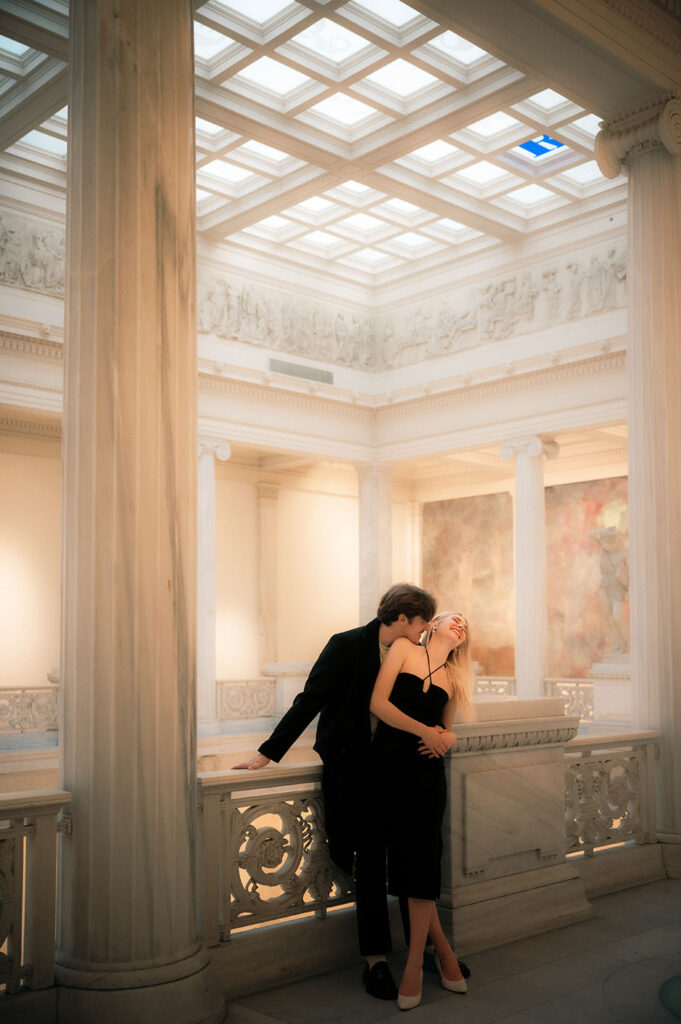 Couple kissing at the Hall of Sculpture in Carnegie Museum of Art in Pittsburgh
