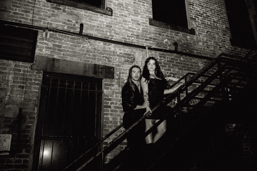 Couple Standing in an Alley's staircase