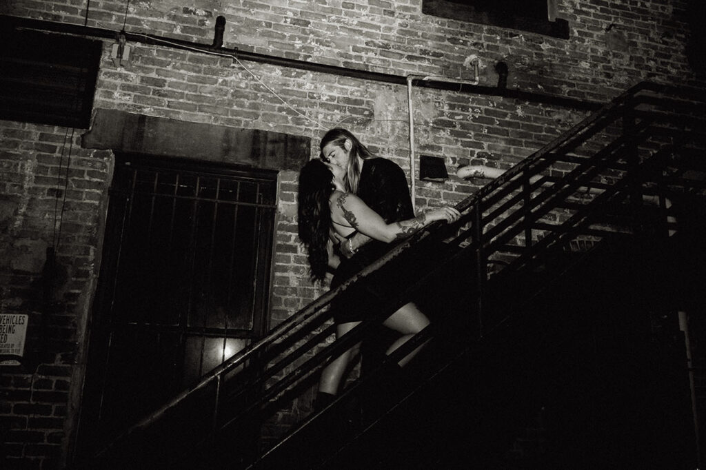 Couple Standing in an Alley's staircase