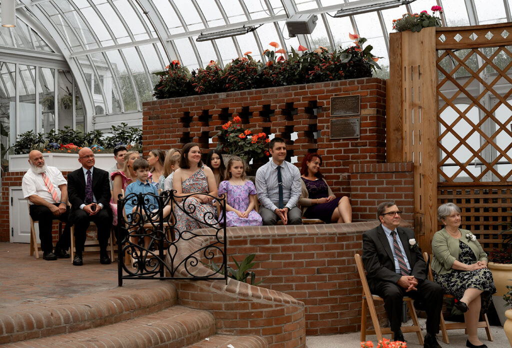 Guests looking at bride and groom getting married at Phipps Conservatory 