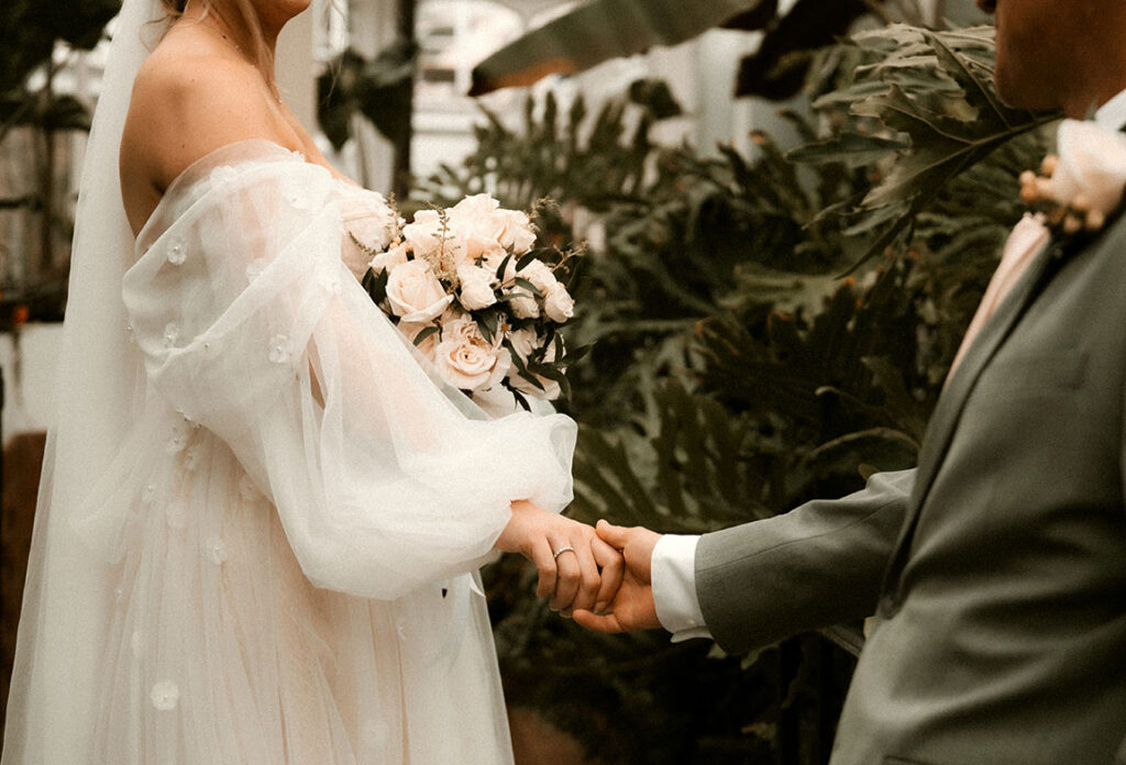 Bride and Groom Hold Hand at Phipps Conservatory and Botanical Garden