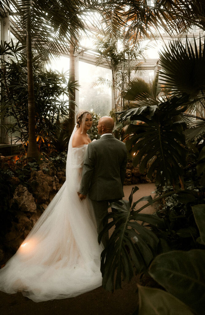 Bride and Groom Look at each other at Phipps Conservatory and Botanical Gardens