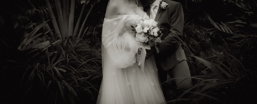 Black and White Bride and Groom Hold each other at Phipps 