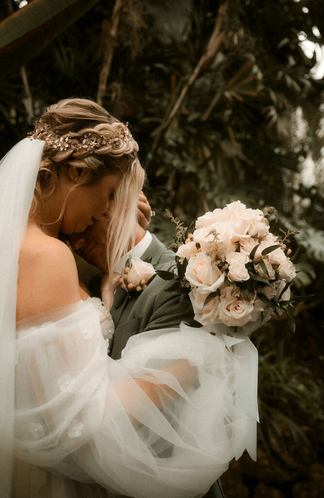 Bride and Groom Embracing at Phipps Conservatory after their wedding