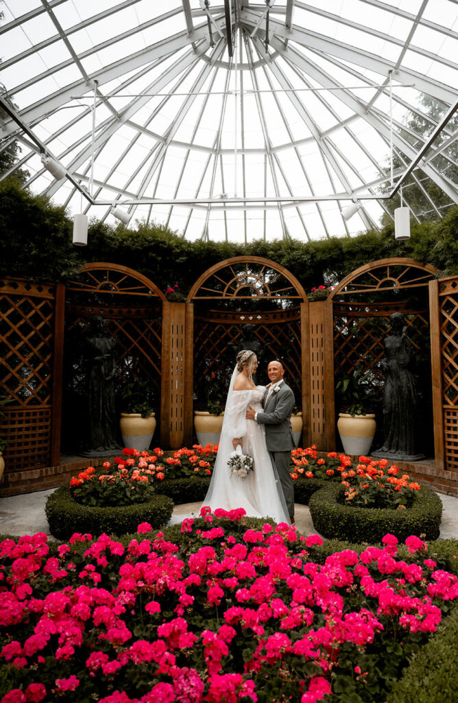 Bride and Groom looking at each other  at the Broderie Room in Phipps Conservatory Wedding