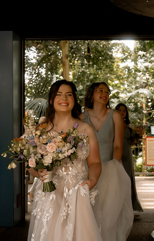 Bride walking at Phipps Wedding smiling