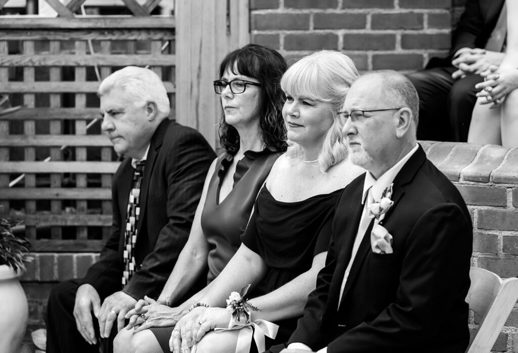 BW Guests during wedding ceremony at the Broderie Room at Phipps