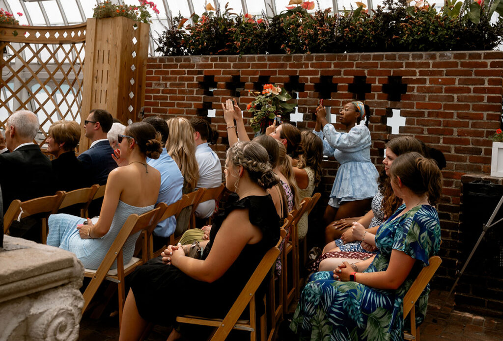 Guests during wedding ceremony at the Broderie Room at Phipps