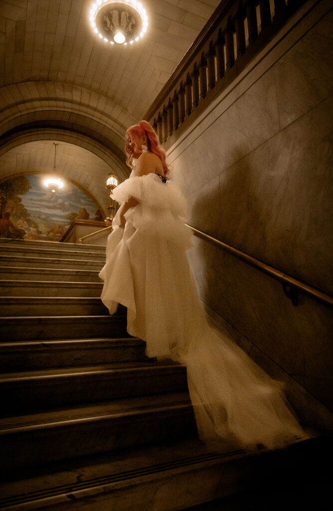 Bride going up the staircase of Allegheny County Courthouse