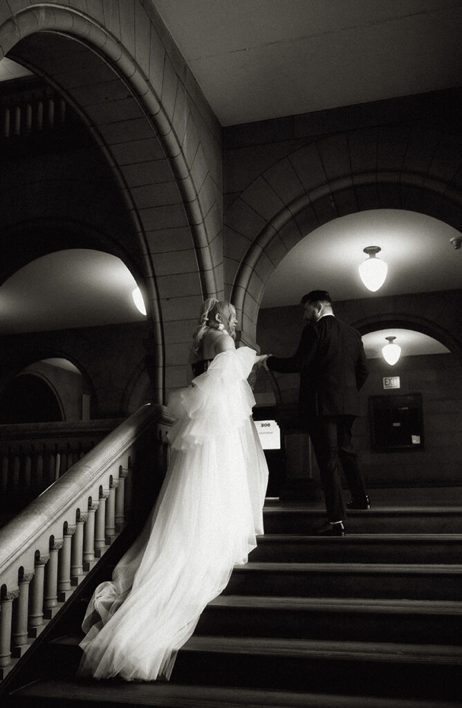 Bride and Groom Going up the staircase of the Allegheny County Courthouse in Downtown Pittsburgh