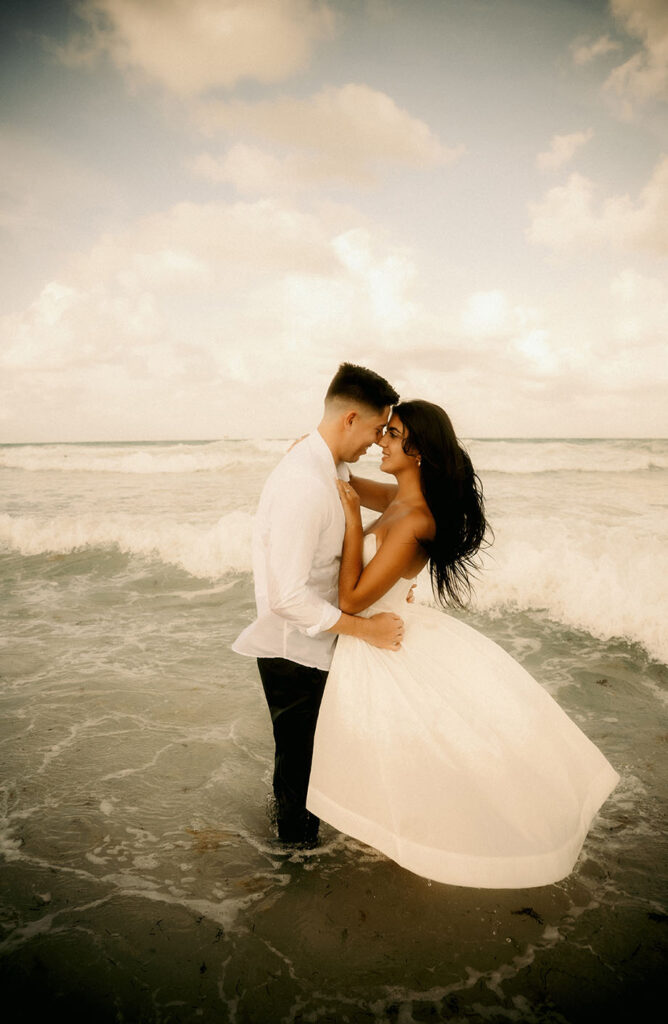 Couple Face each other in the ocean