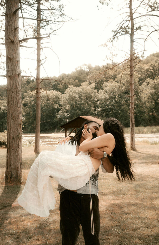 Couple kiss at their romantic engagement