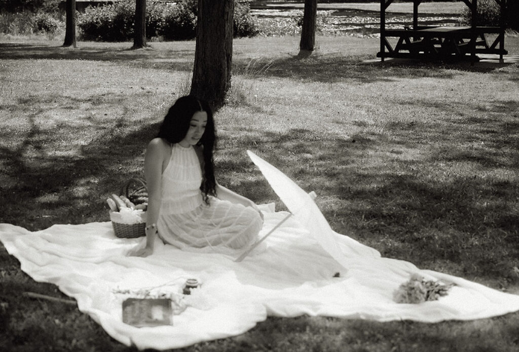 Bride sit in a picnic in her romantic engagement