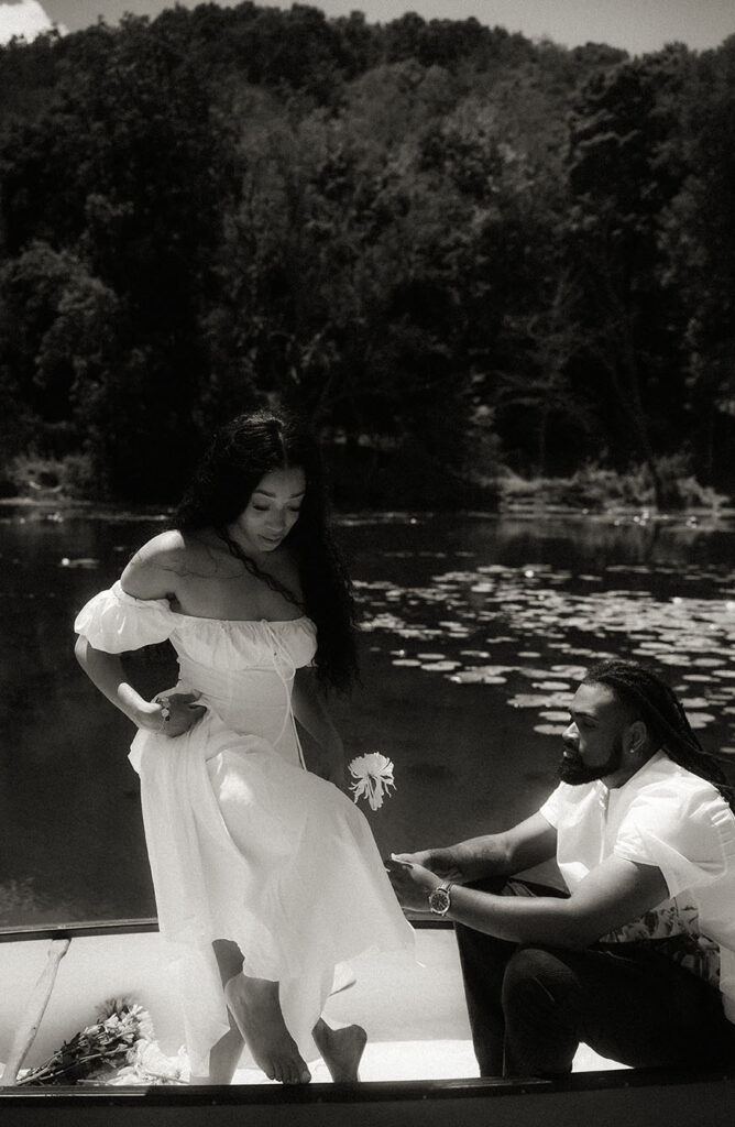 BW photo of couple during their engagement in a lake