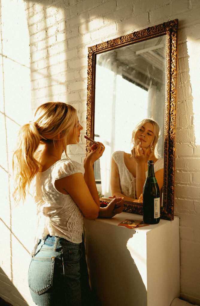 Woman looking at herself in industrial Pittsburgh Building